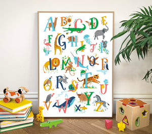 Children's Animal alphabet A-Z poster with animals on a wall in a room with toys and books.