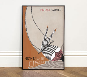 Framed poster of Nights at the Circus by Angela Carter  'Vintage Carter' with circus-themed design on a wooden floor.