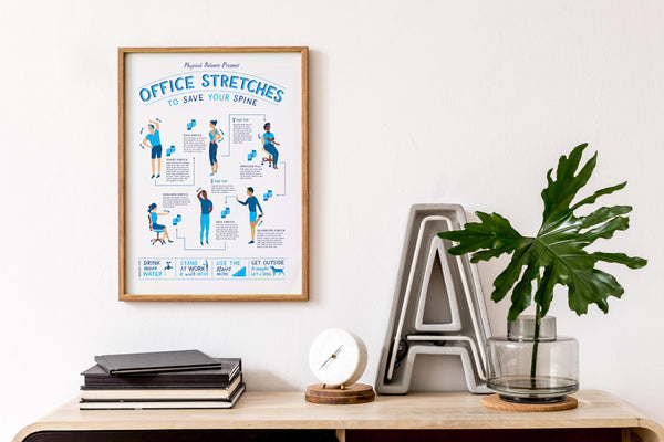 Framed Office Stretches poster on a wall above a wooden shelf with books, a plant, and decorative letters.