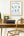 Framed Office Stretches poster on a wall above a desk with a typewriter and chair.