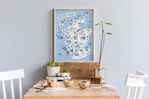 Map of Scotland illustration on a wall above a dining table with decor items.