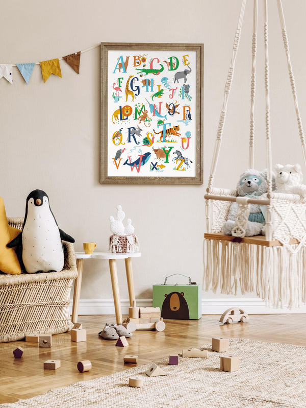 Children's room with a framed animal A-Z alphabet poster, toys, and a penguin plush toy.